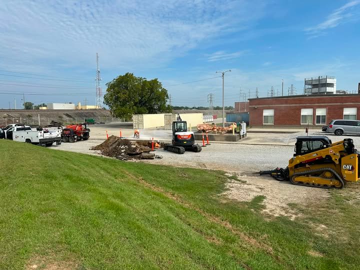 Harris Excavating crew with a skid steer and mini excavator on an industrial site